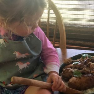 A family member examines the dish