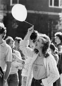 Photo of woman holding balloon