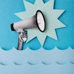 In a collage style image, a hand holds a megaphone above blue waves.